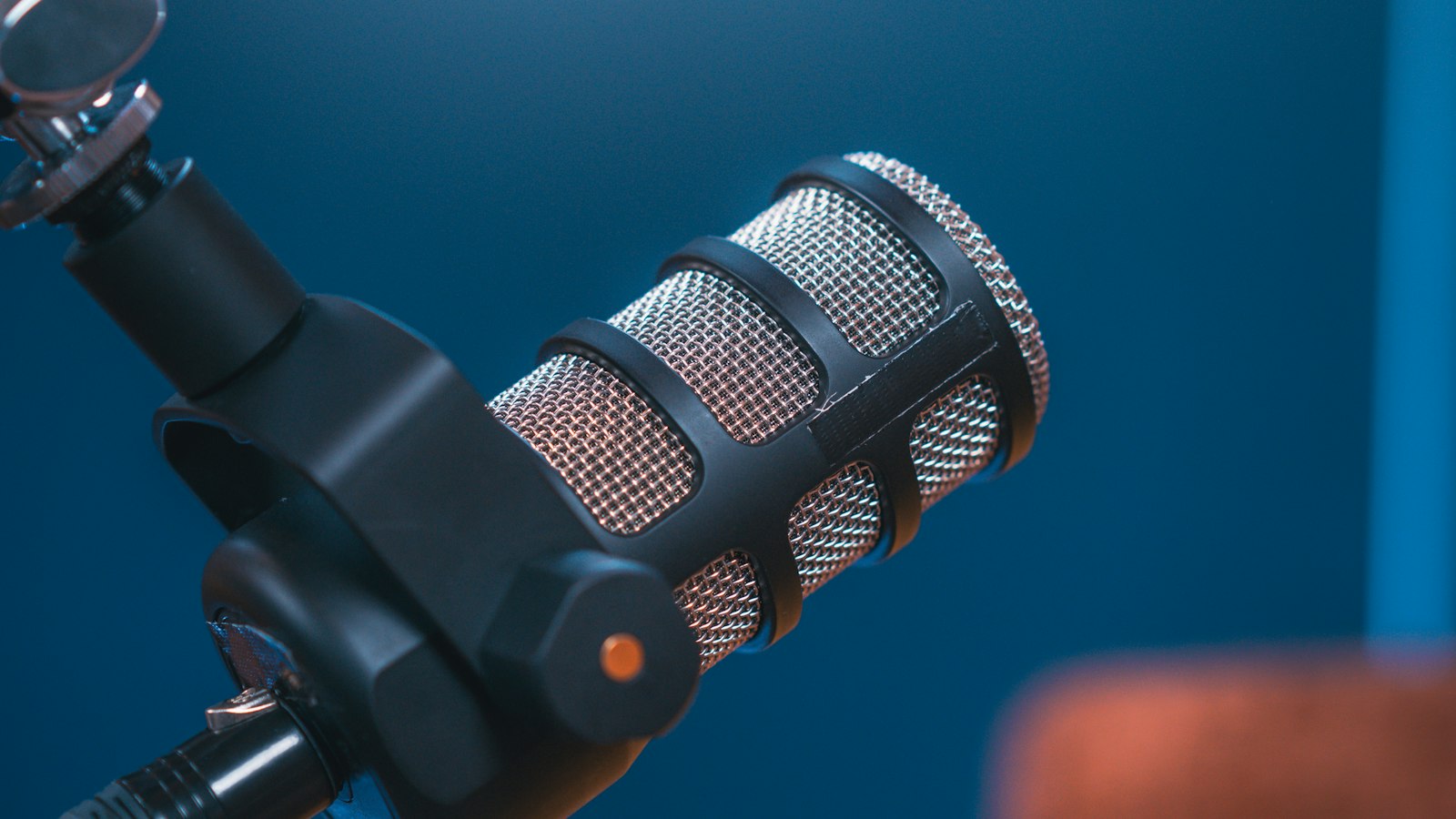 A professional microphone in a recording studio, representing sponsored media