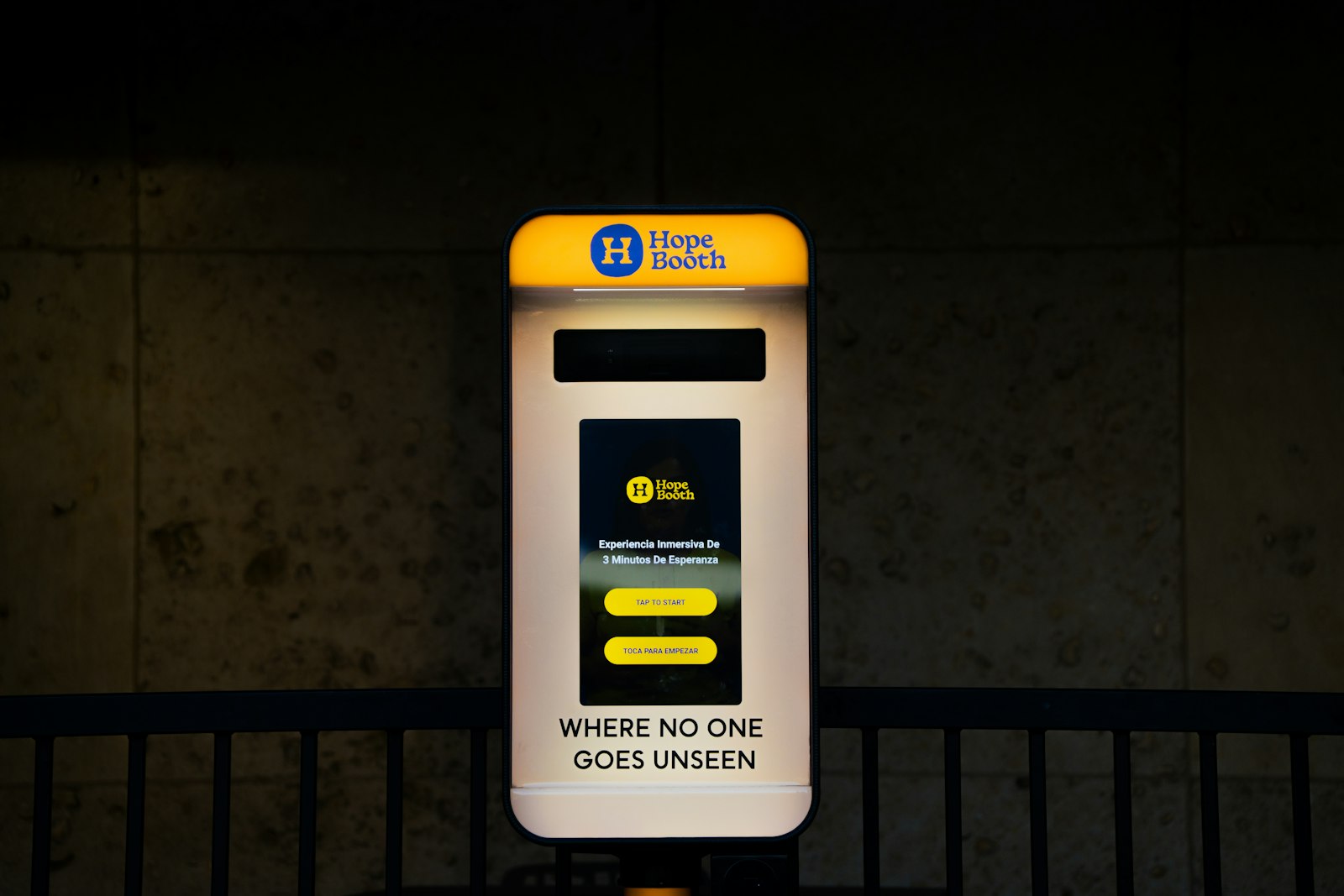A brightly lit self-service kiosk with buttons and text on screen, representing interactive elements inside an email